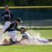 Huron High School Demetrius Sims slides into second base during the first game against Pioneer on Monday, May 13. Daniel Brenner I AnnArbor.com